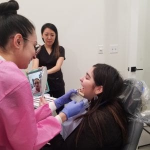 Elevate team trying out glo modern dentistry whitening systems